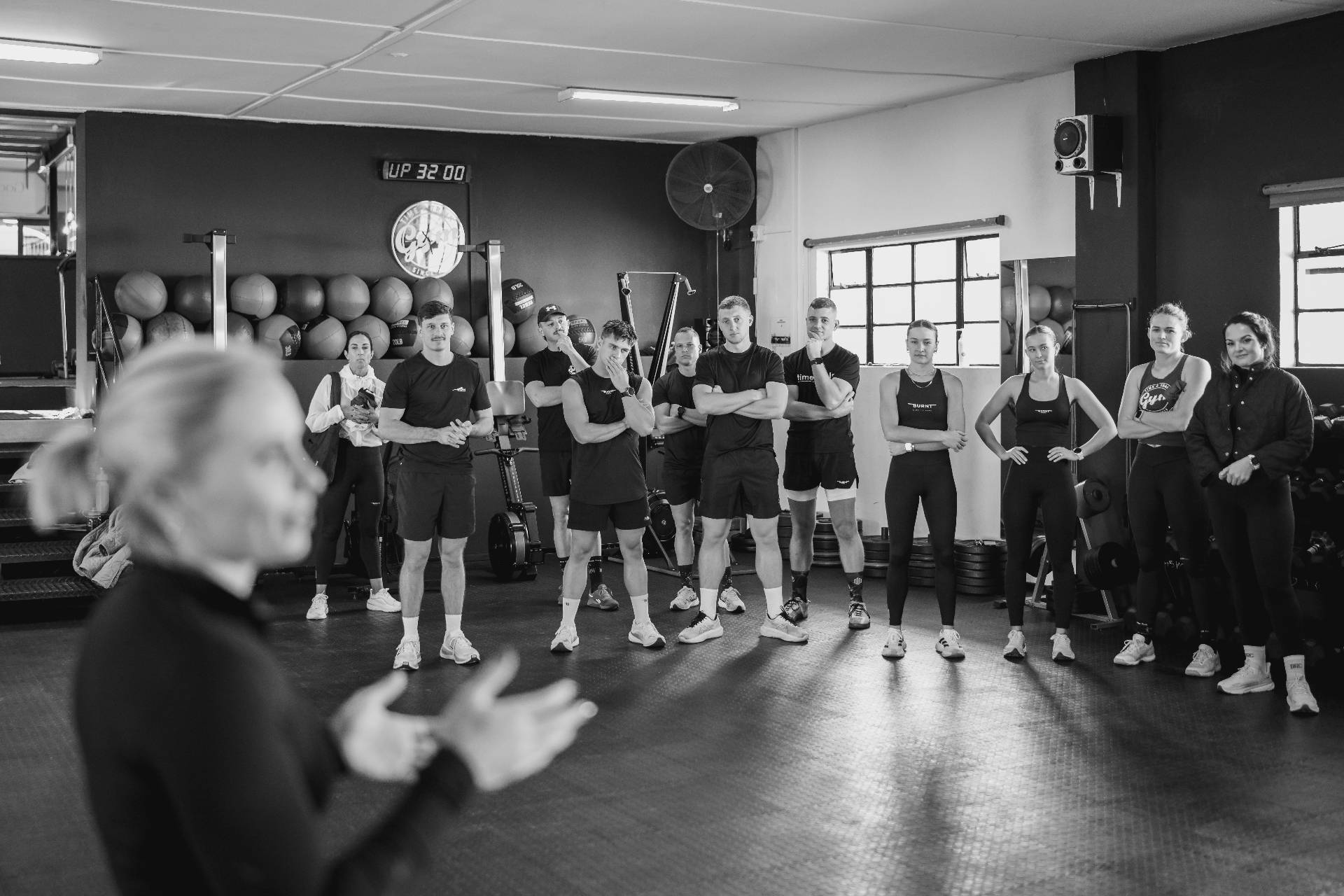 Time2Train coaching team and members in the gym